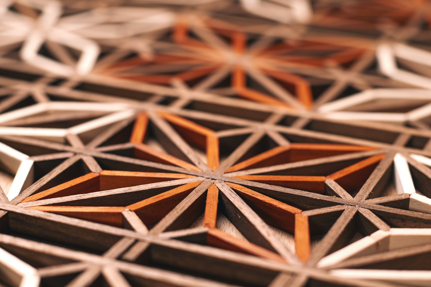 Intricate wooden geometric pattern with interlocking shapes.